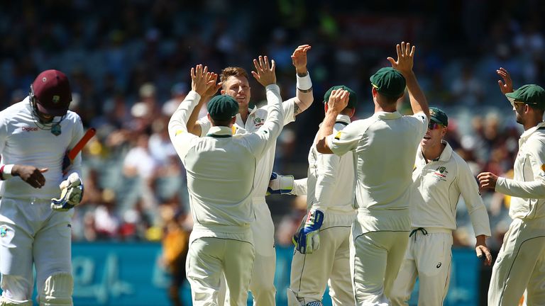 James Pattinson of Australia is congratulated by his teammates after dismissing Carlos Brathwaite 