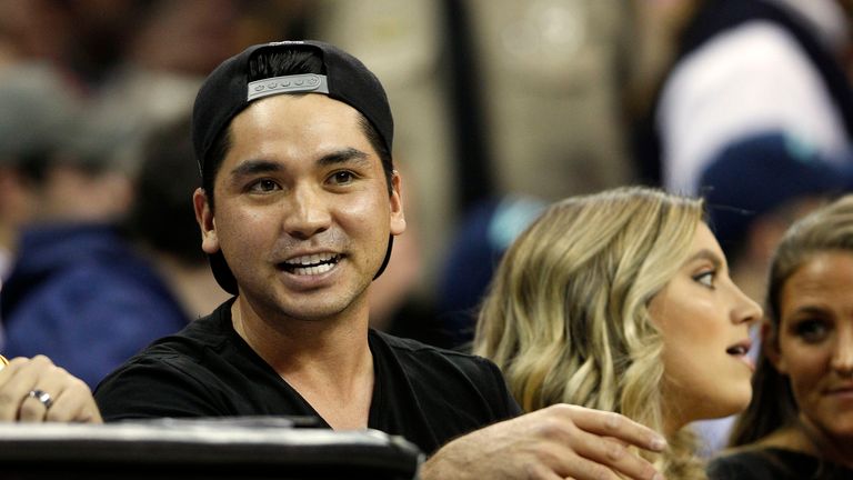 Jason Day with his wife Ellie before the collision. Mrs Day was stretchered out of the arena