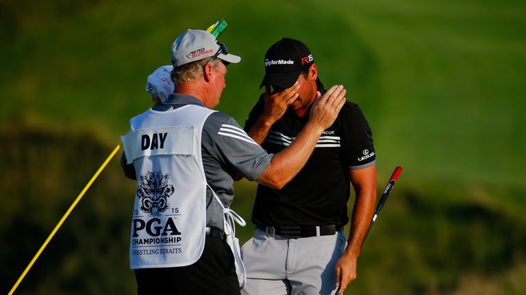 SHEBOYGAN, WI - AUGUST 16:  Jason Day of Australia celebrates with his caddie Colin Swatton on the 18th green after winning the 2015 PGA Championship with 