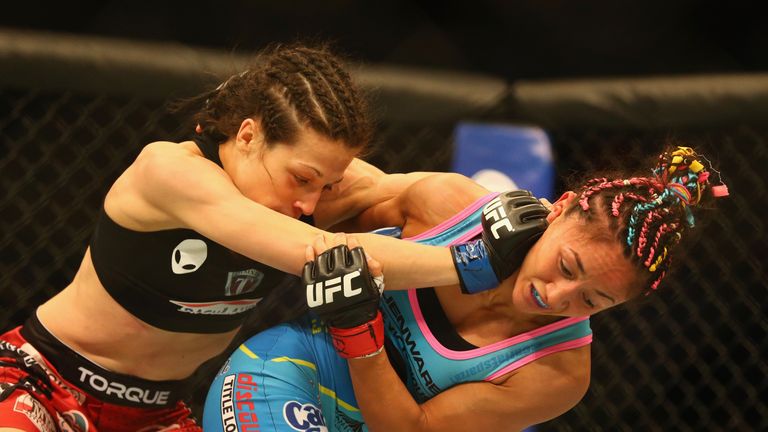 Joanna Jedrzejczyk (left)  fights with  Carla Esparza in the Women's Strawweight bout during the UFC 185 event at American Airlines C