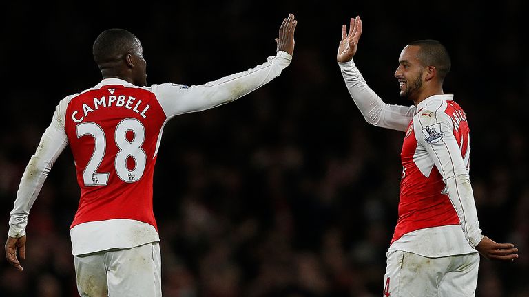 Arsenal's English midfielder Theo Walcott (R) celebrtes scoring his team's first goal v Man City with Joel Campbell