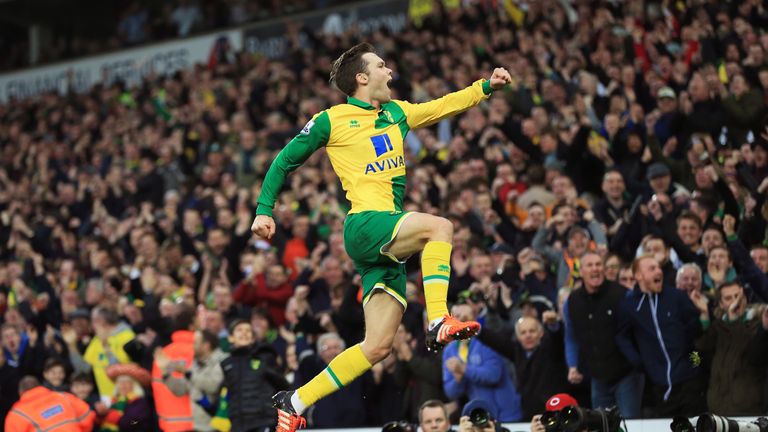 Jonny Howson of Norwich City celebrates scoring his team's first goal against Aston Villa