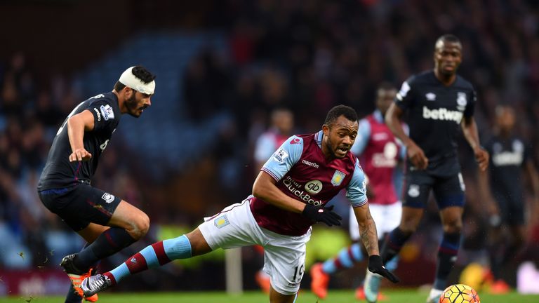 Jordan Ayew of Aston Villa is tackled by James Tomkins of West Ham United 