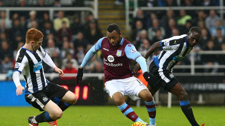 Jordan Ayew of Aston Villa is tackled by Jack Colback of Newcastle United