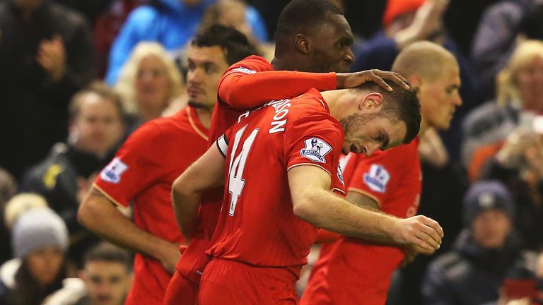 Jordan Henderson of Liverpool is congratulated by Christian Benteke after scoring