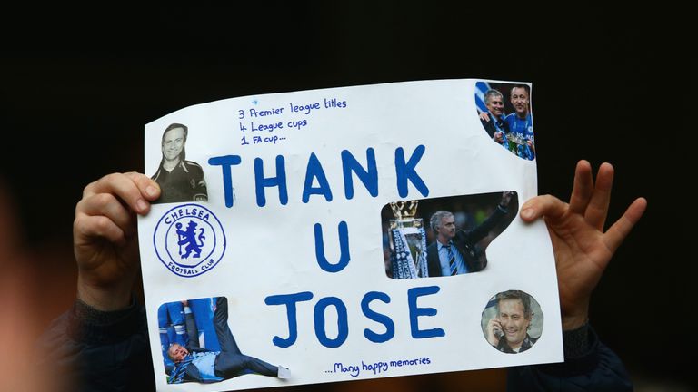 A Chelsea fan holds a banner to appreciate Jose Mourinho