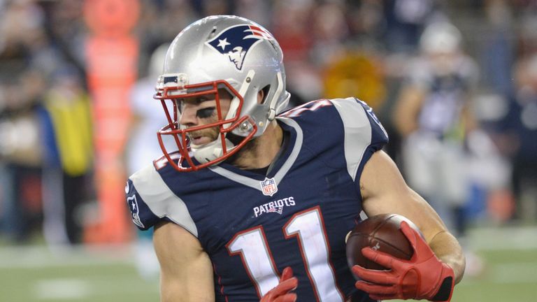 Julian Edelman #11 of the New England Patriots  carries the ball after a catch during the first quarter against the Miami Dolphi