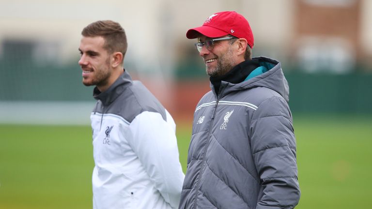 Manager Jurgen Klopp (R) and Jordan Henderson look on  during the Liverpool training session at Melwood