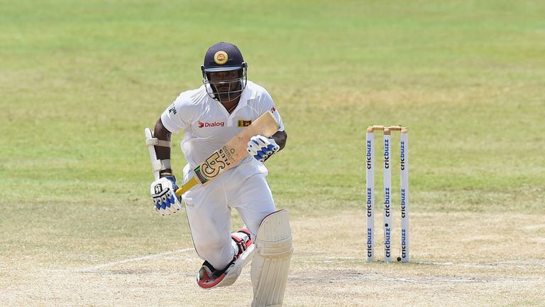 Sri Lankan cricketer Kusal Perera runs between the wickets during the fifth and final day of the third and final Test match between Sri Lanka and India