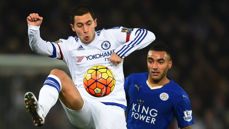 Eden Hazard controls the ball under pressure from Danny Simpson