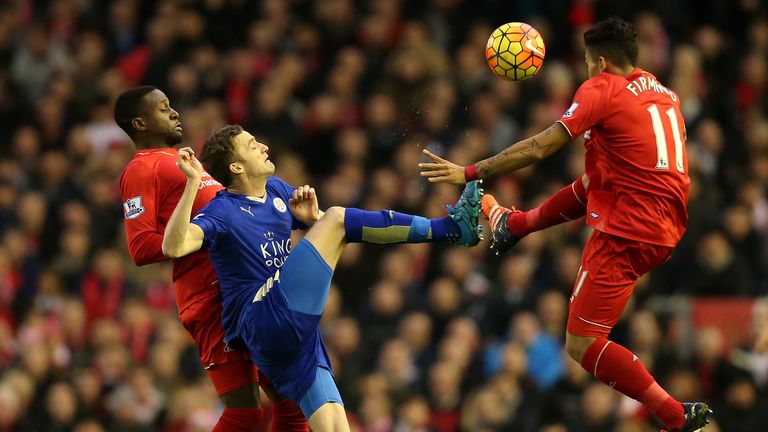 Andy King battles for the ball with Divock Origi and Roberto Firmino
