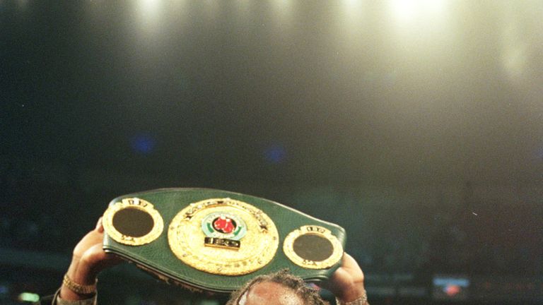 13 Nov 1999: Lennox Lewis displays his championsip belts after defeatin Evamder Holyfield in  the World Heavyweight Championship unification fight at the T