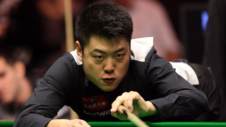 Liang Wenbo in action against Tom Ford during day nine of the 2015 Betway UK Snooker Championship