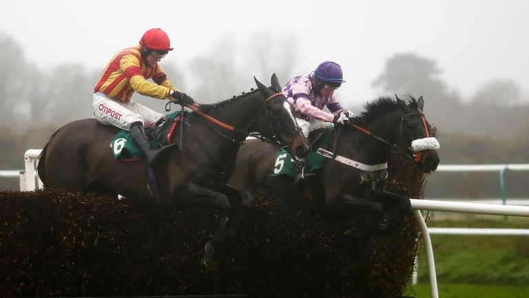 Gavin Sheehan riding Warrantor (right) clear the last to win the Holzheim Mienzies Rock Munich Beginners' Chase at Lingfield