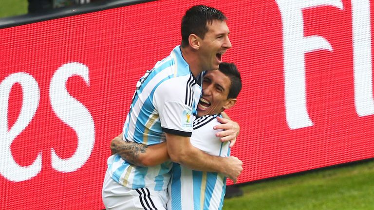 Lionel Messi celebrates a goal for Argentina with Angel di Maria at the World Cup
