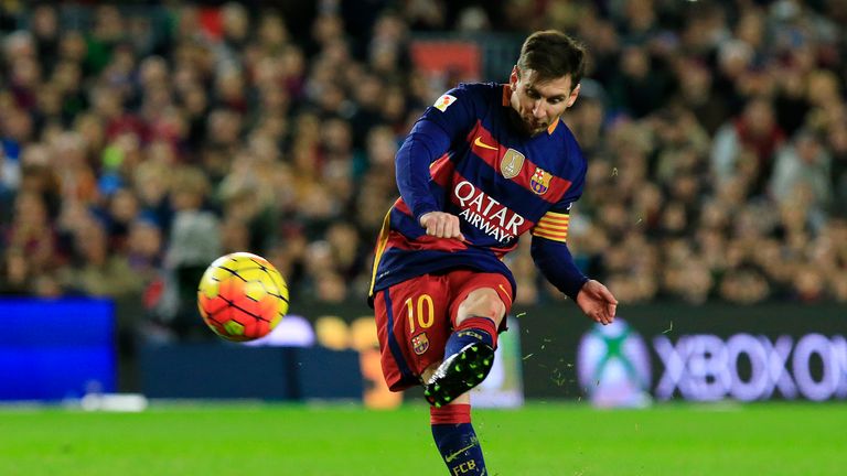 Barcelona's Lionel Messi kicks the ball