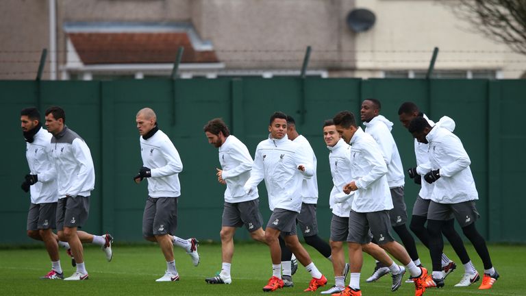 Phillipe Coutinho (third left) trains with the rest of the Liverpool prior to flying out to Switzerland