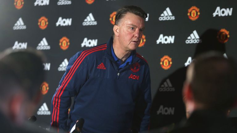 Louis van Gaal walks out of a Manchester United press conference