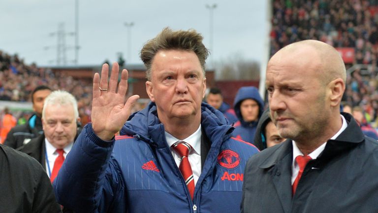 Manchester United manager Louis van Gaal holds his hand up as he leaves the pitch at the Britannia Stadium