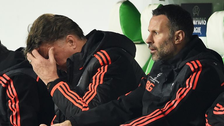 A dejected Manchester United manager Louis van Gaal  (left) with assistant Ryan Giggs 