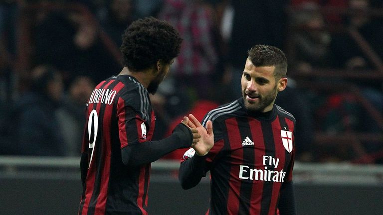 Luiz Adriano (L) of AC Milan celebrates with his team-mate Antonio Nocerino (R) after scoring the opening goal during the TIM 