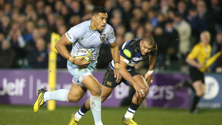 Luther Burrell of Northampton breaks away from Jonathan Joseph to score an intercept try against Bath