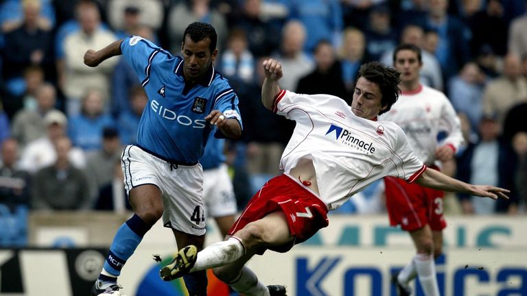  David Prutton of Forest tackles Ali Benarbia of Man City