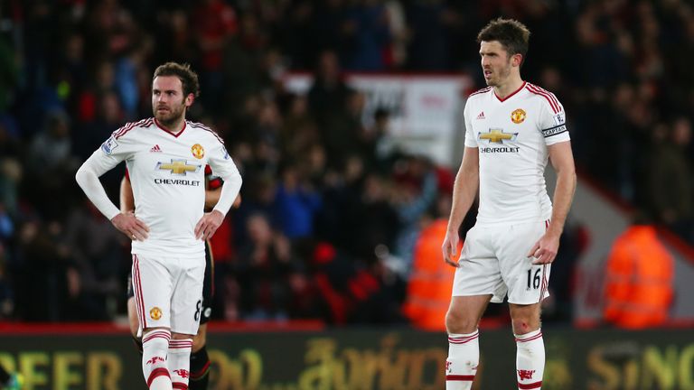 Juan Mata and Michael Carrick of Manchester United show their dejection after conceding a second goal to Bournemouth