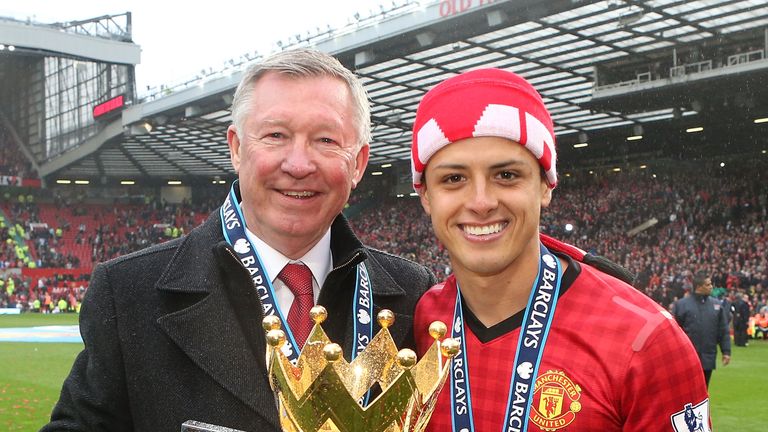 Manchester United manager Sir Alex Ferguson and Javier Hernandez celebrate with the Premier League trophy in 2013