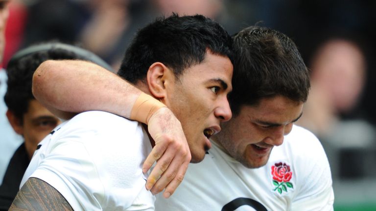 England's centre Manusamoa Tuilagi (L) is congratulated by his teammate England's centre Brad Barritt after scoring a try during the rugby union 6 Nations 