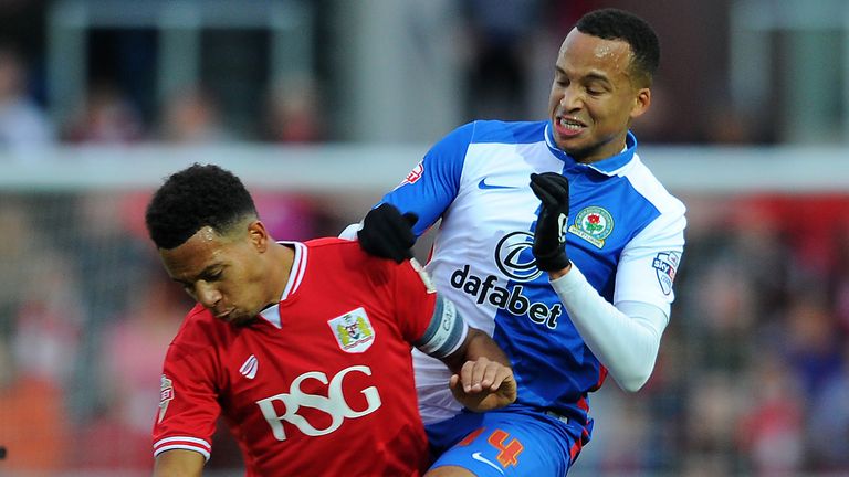 BRISTOL, ENGLAND - DECEMBER 5: Marcus Olsson of Blackburn Rovers is tackled by Korey Smith of Bristol City during the Sky Bet Championship match between Br