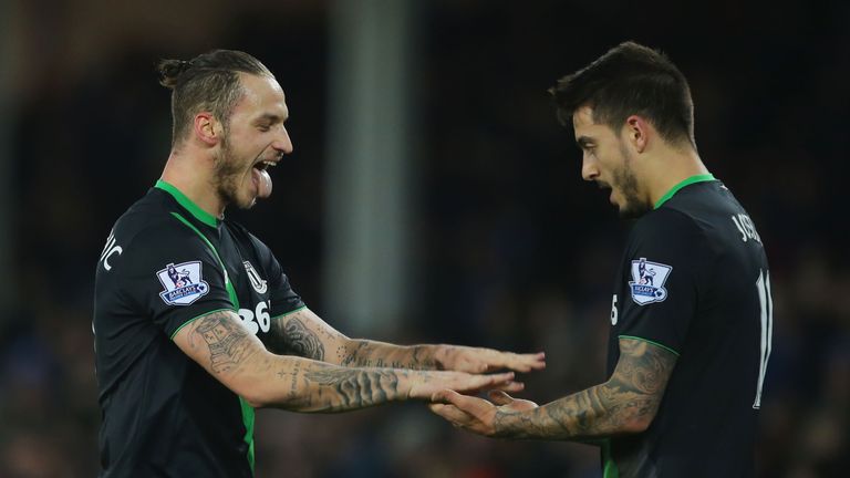 Marko Arnautovic (L) celebrates scoring Stoke City's winning goal with his team mate Joselu (R) during the match against Everton