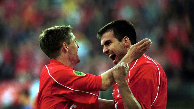 Markus Babbel celebrates with teammate Michael Owen after scoring the opening goal for Liverpool during the UEFA Cup Final