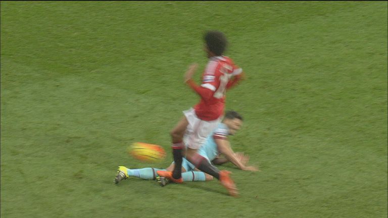 Fellaini appeared to plant his right foot on the shin of Tomkins