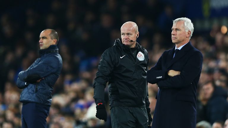 Roberto Martinez, manager of Everton and Alan Pardew, manager of Crystal Palace, look on during the game