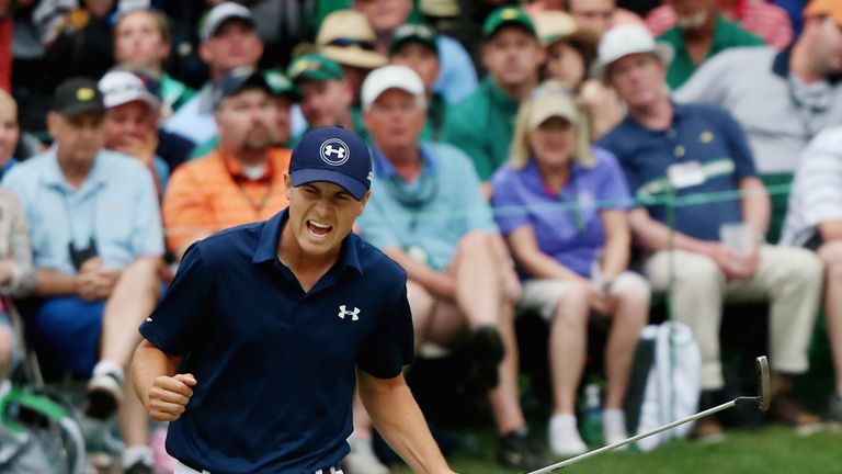 Jordan Spieth of the United States reacts to a par-saving putt on the 16th green during the final round of the 2015 Masters 