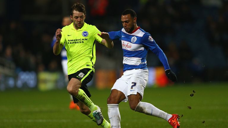 Matt Phillips of QPR (R) and Dale Stephens of Brighton (L) compete for the ball
