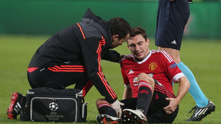 Darmian receives treatment during Tuesday's 3-2 defeat at Wolfsburg