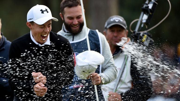 WOBURN, ENGLAND - OCTOBER 11:  Matthew Fitzpatrick of England is sprayed with sparkling wine as he celebrates on the 18th after final round of the British 