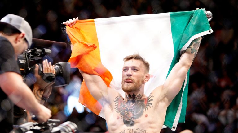 Conor McGregor in celebratory mood after beating Jose Aldo