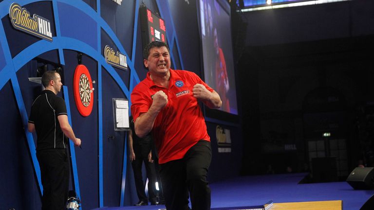 WILLIAM HILL WORLD DARTS CHAMPIONSHIP 2016.ALEXANDRA PALACE,LONDON.PIC;LAWRENCE LUSTIG .ROUND2.MENSUR SULJOVIC V DAVE PALLETT.MENSUR SULJOVIC wins