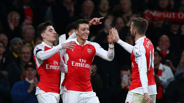 Mesut Ozil of Arsenal celebrates scoring his team's second goal against Bournemouth