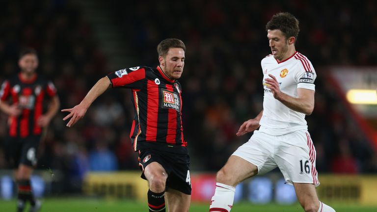 Dan Gosling of Bournemouth and Michael Carrick of Manchester United compete for the ball 