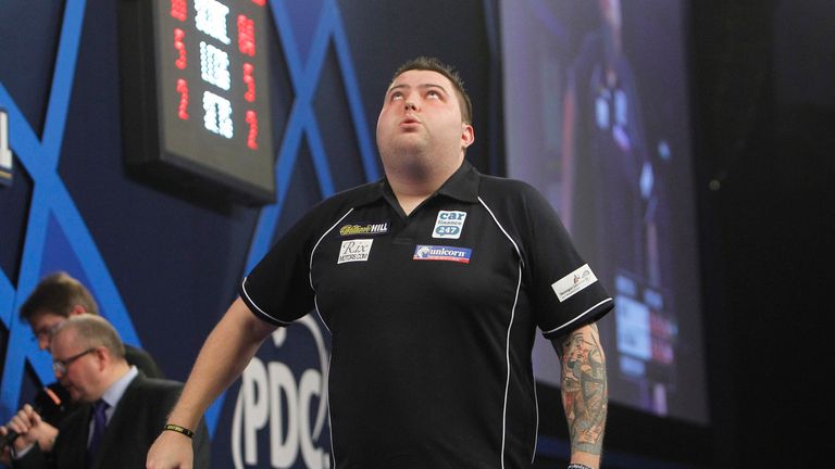 WILLIAM HILL WORLD DARTS CHAMPIONSHIP 2016.ALEXANDRA PALACE,LONDON.PIC;LAWRENCE LUSTIG . ROUND1.MICHAEL SMITH V JEFFREY DE ZWAAN.MICHAEL SMITH IN ACTION