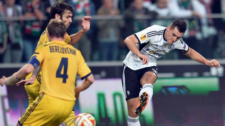 Legia Warsaw's Michal Zyro shoots on a goal during the UEFA Europa League group L football match between Legia Warszawa vs Metalist Kharkiv on November 6, 