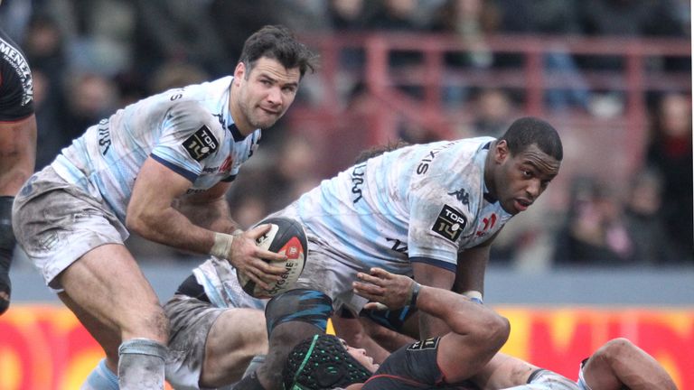 Racing 92's scrum-half Mike Phillips passes the ball