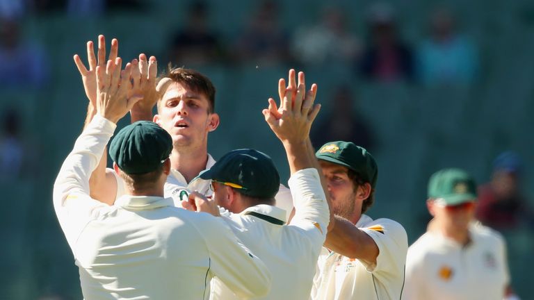 MELBOURNE, AUSTRALIA - DECEMBER 29:  Mitch Marsh of Australia  is congratulated by team mates after getting the wicket of Denesh Ramdin of the West Indies 