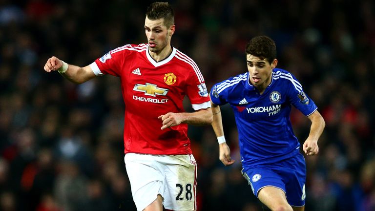 MANCHESTER, ENGLAND - DECEMBER 28:  Morgan Schneiderlin of Manchester United battles for the ball with Oscar of Chelsea during the Barclays Premier League 