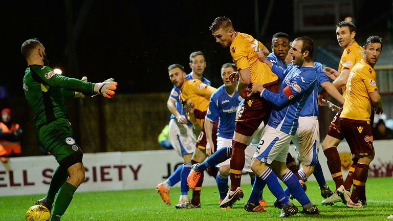 Motherwell's Ben Hall heads the opener past St Johnstone's Alan Mannus 