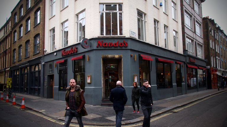 LONDON, ENGLAND - JANUARY 21: People walk past a Nandos restaurant in Soho on January 21, 2015 in London, England. A growing number of campaigners, includi